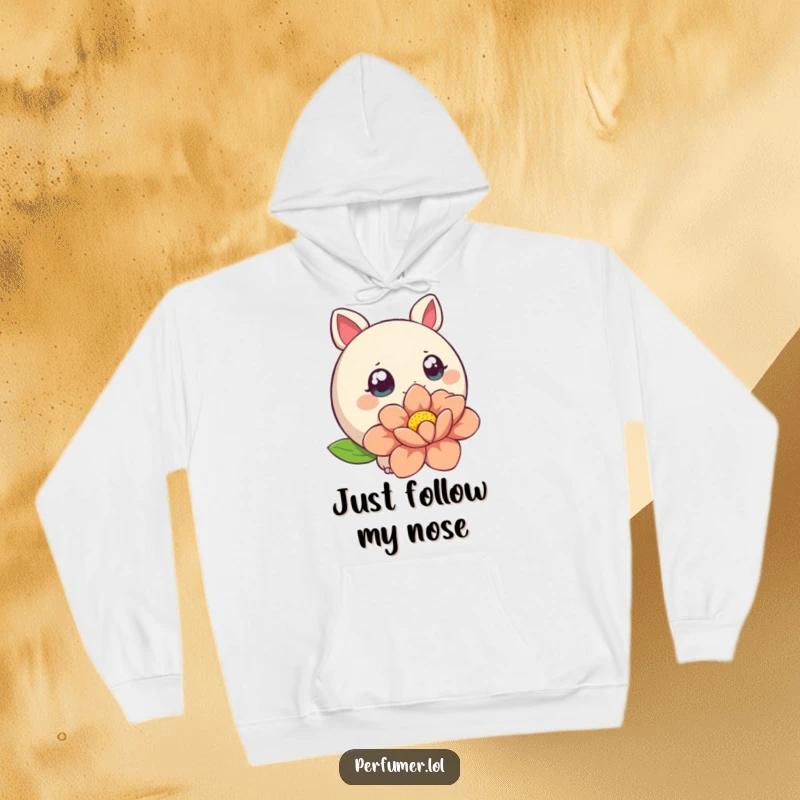 Funny Hoodie with a round creature wide-eyed, sniffing a large stylized flower, combining comfort and whimsy.